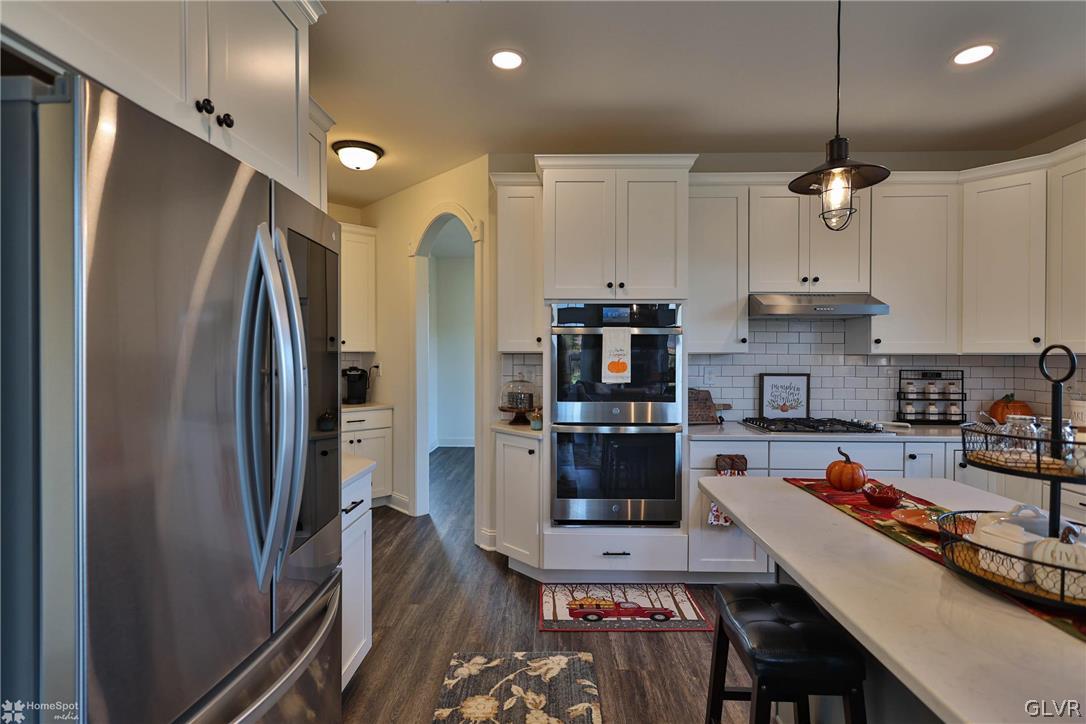 1275 Keller Road Wind Gap, PA 18091 - Photo 14 of 50 a kitchen with stainless steel appliances a refrigerator sink and stove
