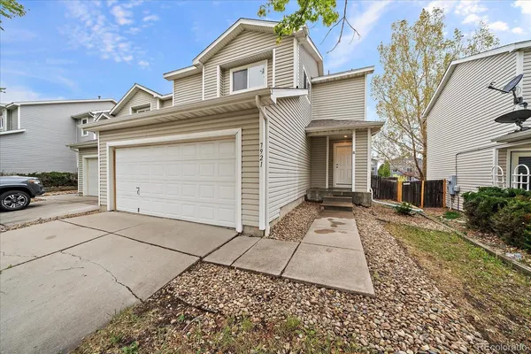 a front view of a house with yard