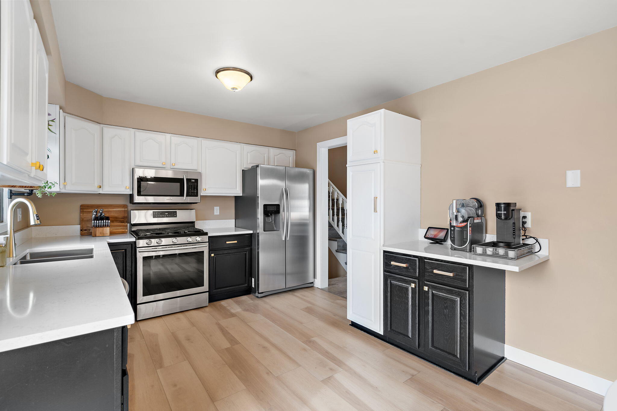 2164 Terrace Drive Highland, IN 46322 - Photo 11 of 34 a kitchen with stainless steel appliances granite countertop a sink stove and refrigerator