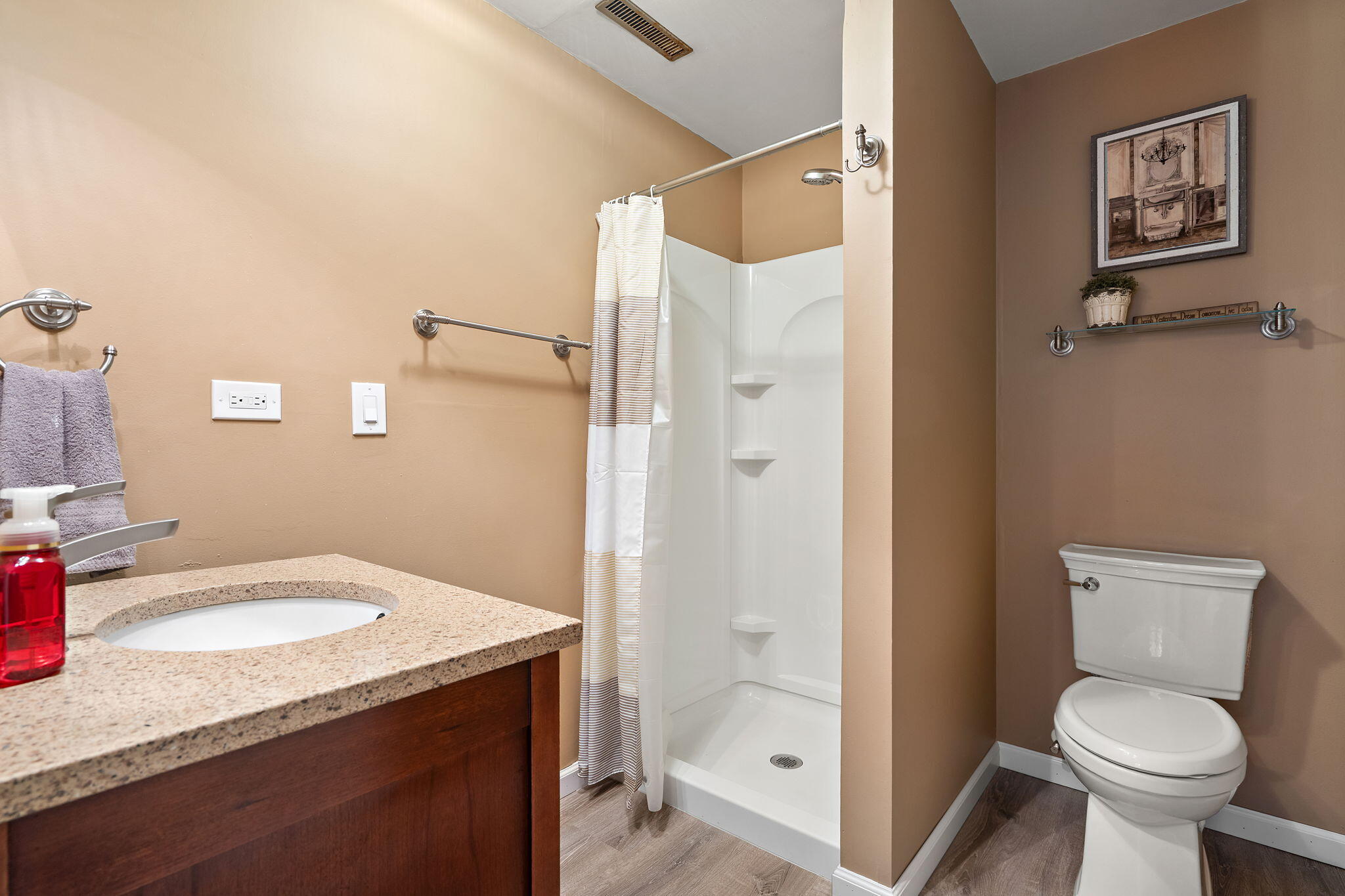 2164 Terrace Drive Highland, IN 46322 - Photo 23 of 34 a bathroom with a granite countertop sink toilet and shower