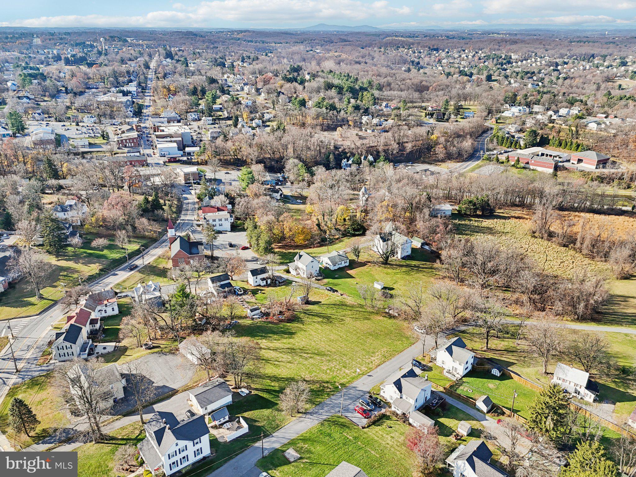 Harrison St Mount Mount Airy, MD 21771 - Photo 16 of 35 an aerial view of residential houses with outdoor space