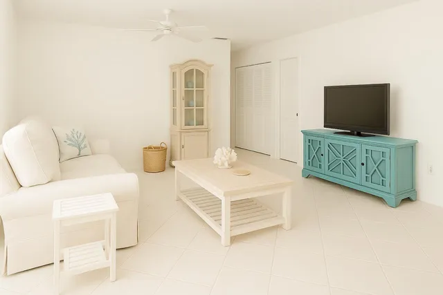 a living room with furniture and flat screen tv