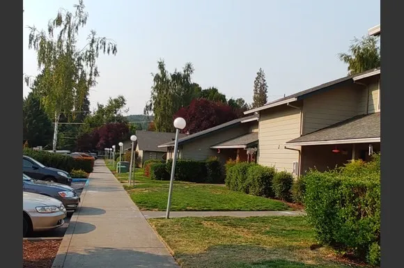 a view of a patio with a table and chairs
