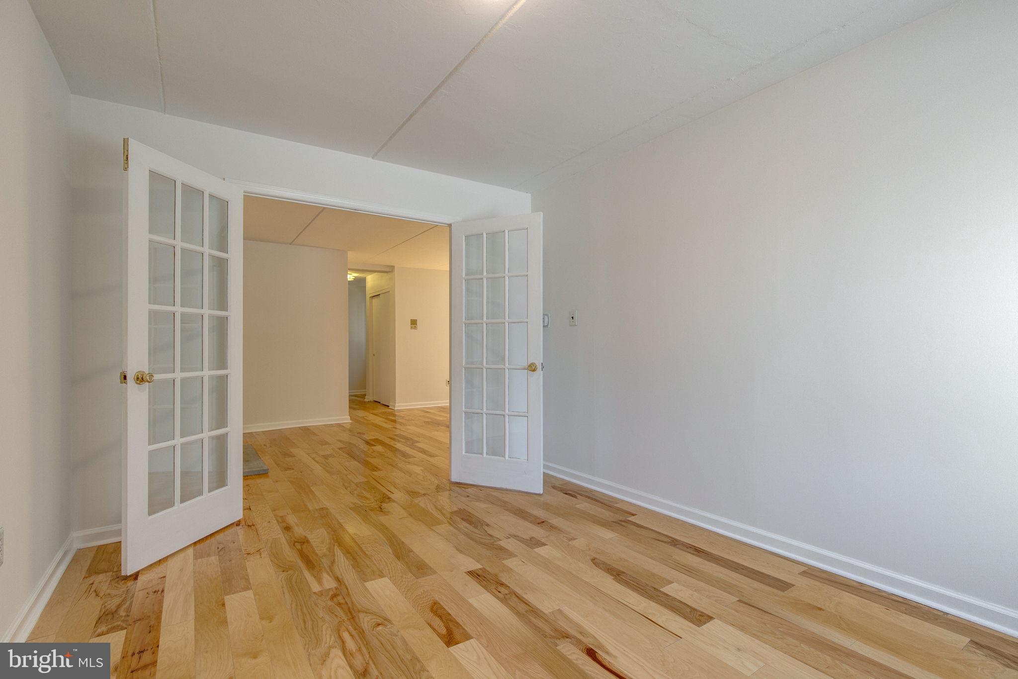 100 Rutgers Avenue, Unit 8 Swarthmore, PA 19081 - Photo 12 of 29 a view of a room with wooden floor and a window