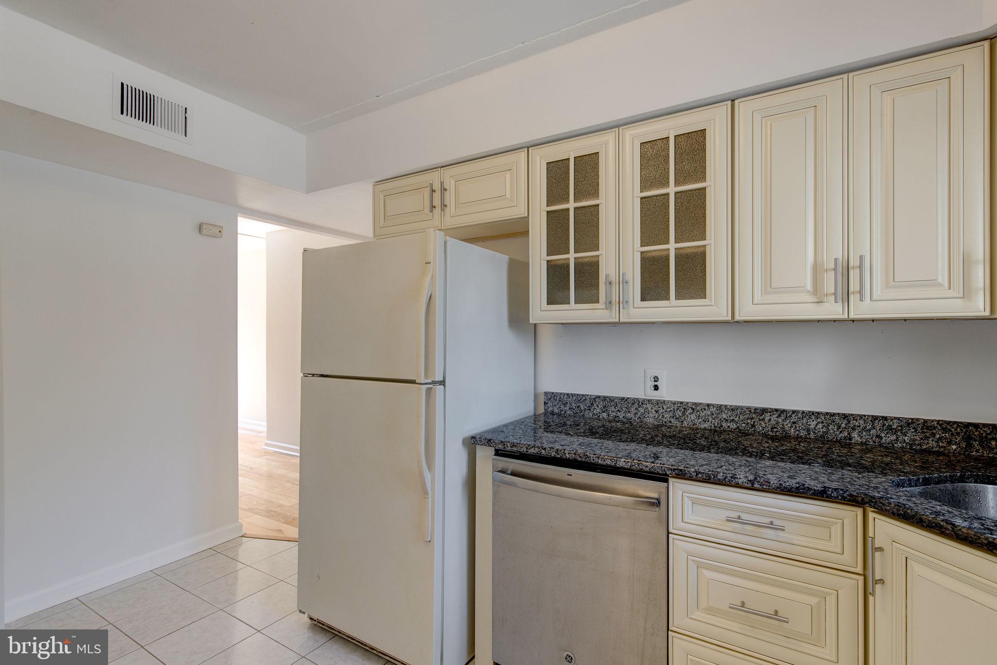 100 Rutgers Avenue, Unit 8 Swarthmore, PA 19081 - Photo 18 of 29 a white refrigerator freezer sitting inside of a kitchen