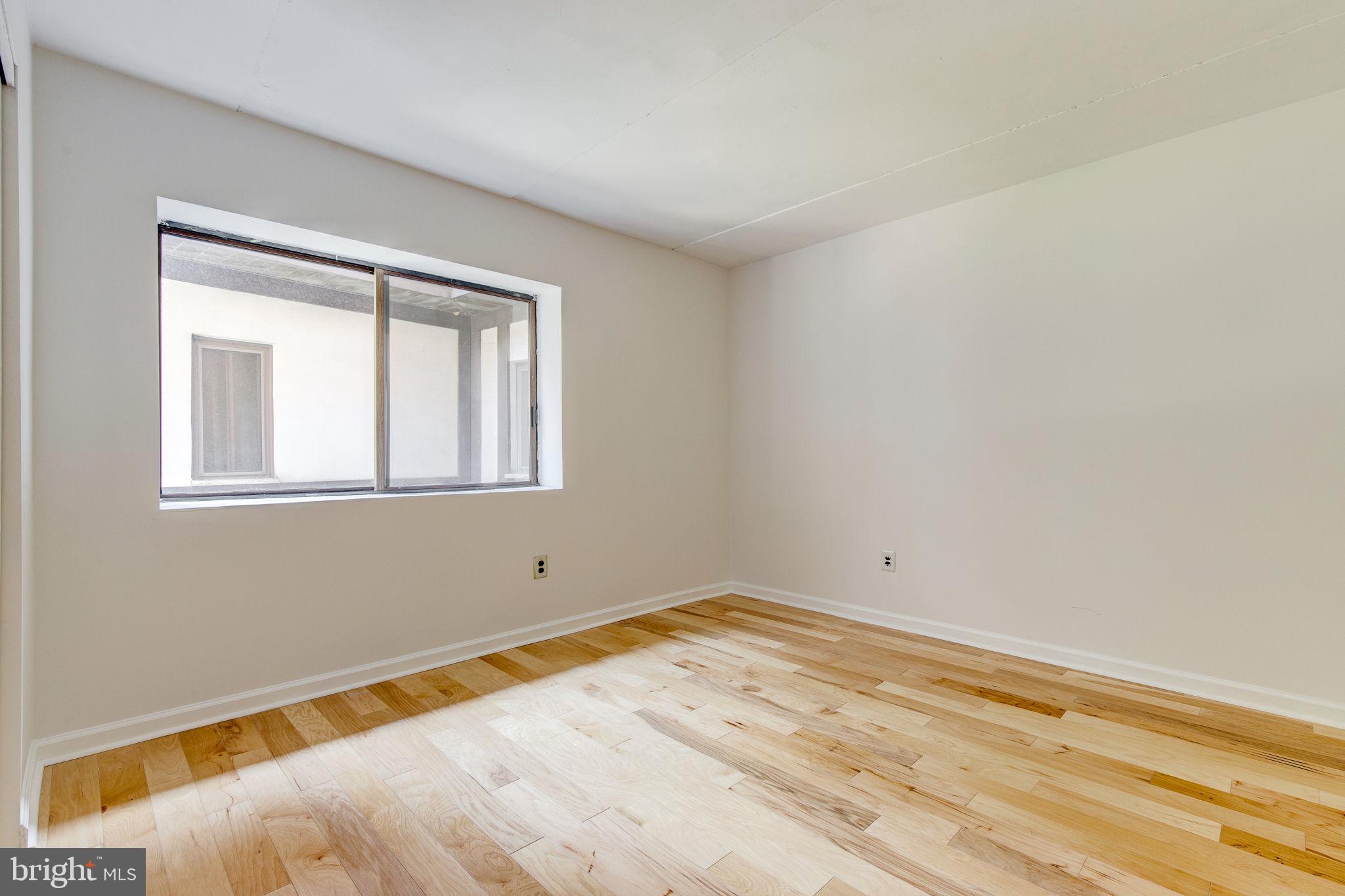 100 Rutgers Avenue, Unit 8 Swarthmore, PA 19081 - Photo 21 of 29 a view of a room with wooden floor and a window