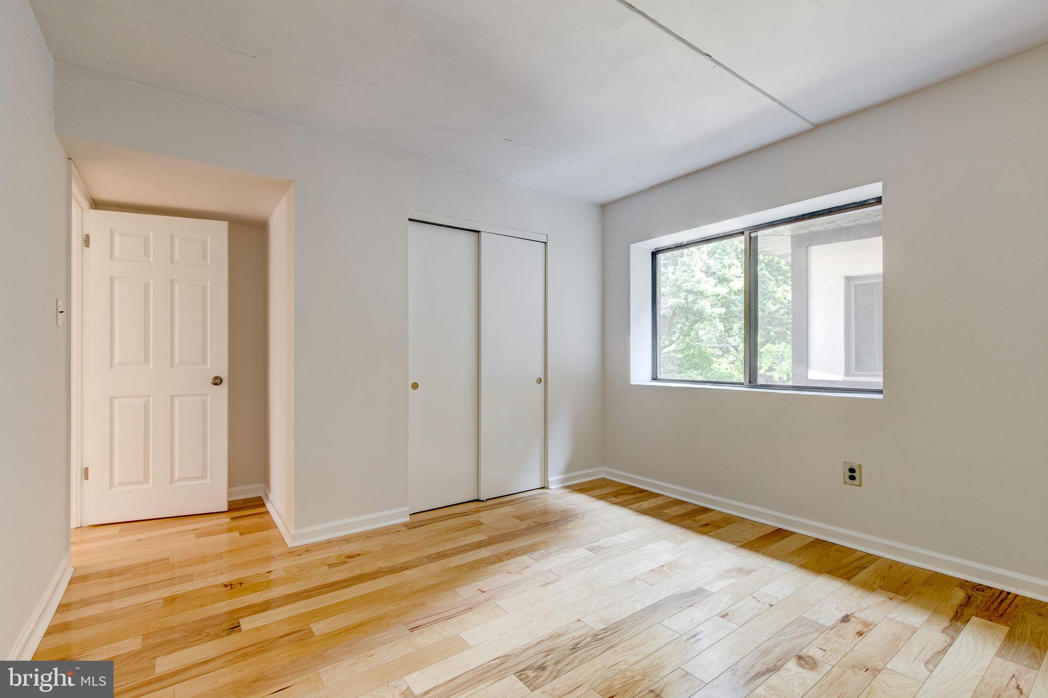 100 Rutgers Avenue, Unit 8 Swarthmore, PA 19081 - Photo 22 of 29 a view of a room with wooden floor and walls