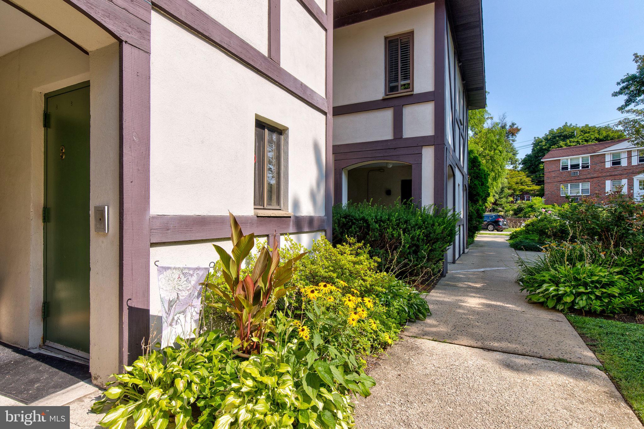 100 Rutgers Avenue, Unit 8 Swarthmore, PA 19081 - Photo 6 of 29 a front view of a house with a yard