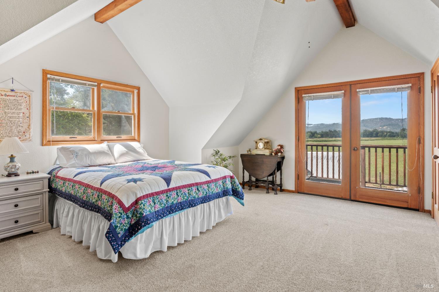 13850 Eel River Road Potter Valley, CA 95469 - Photo 12 of 26 a bedroom with a bed and a large window