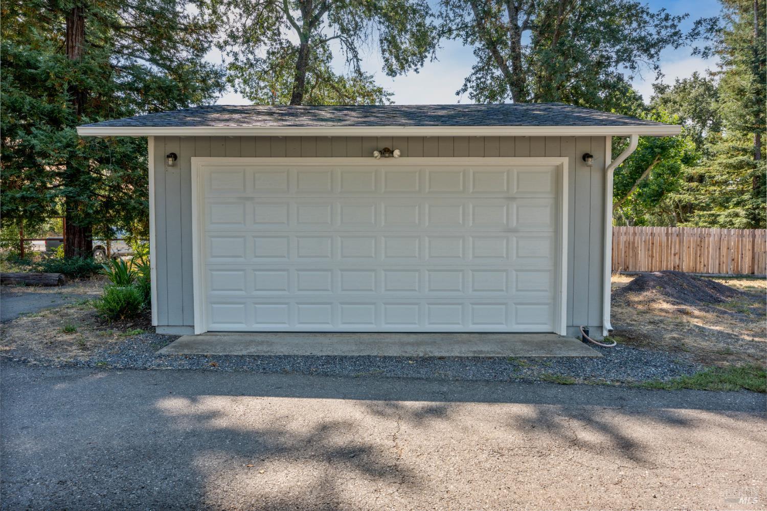 13850 Eel River Road Potter Valley, CA 95469 - Photo 21 of 26 a wooden door in front of a house