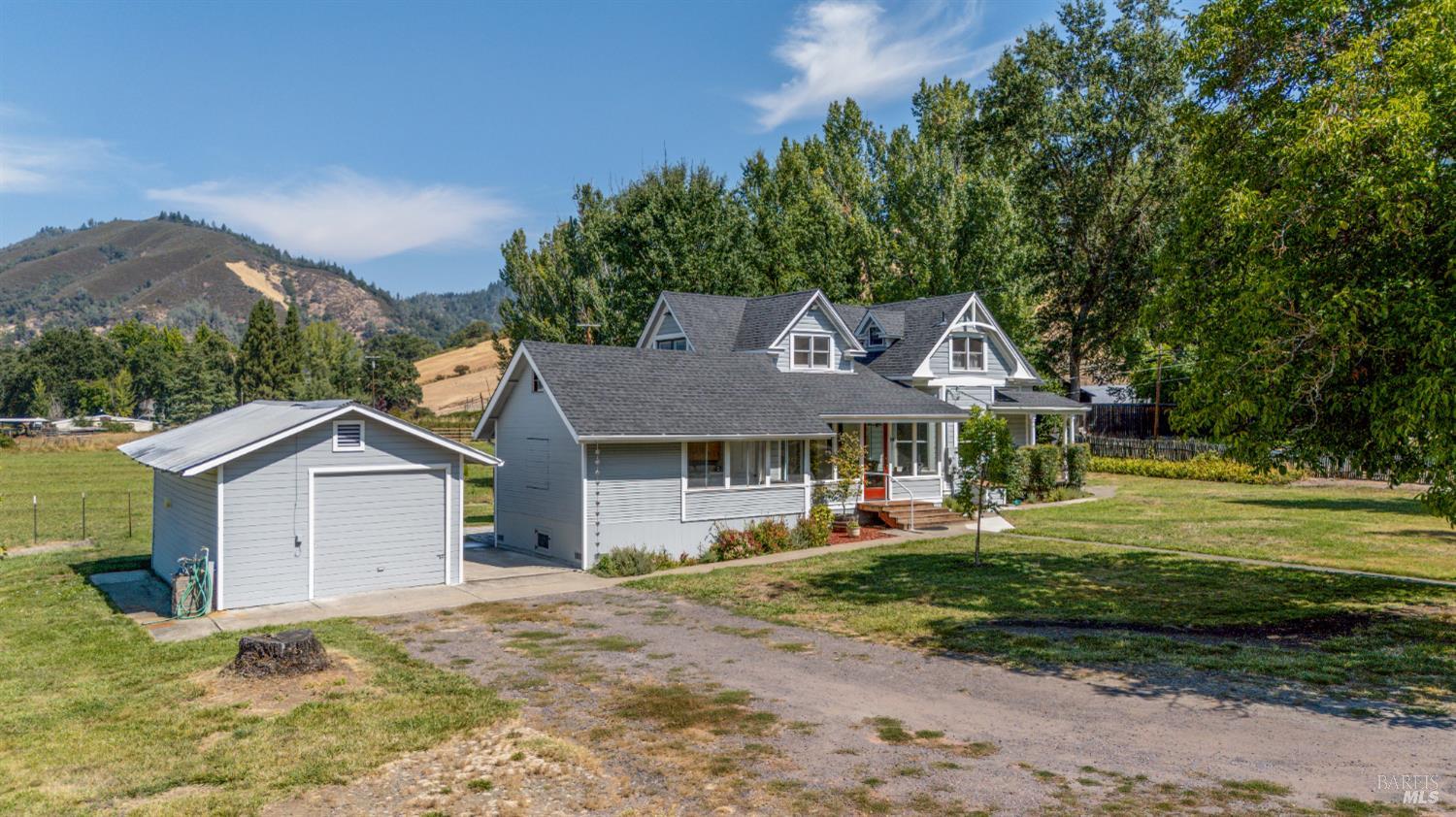 13850 Eel River Road Potter Valley, CA 95469 - Photo 24 of 26 a front view of a house with a garden