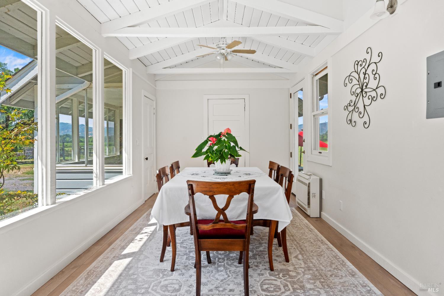 13850 Eel River Road Potter Valley, CA 95469 - Photo 3 of 26 a dining room with furniture a rug and a potted plant