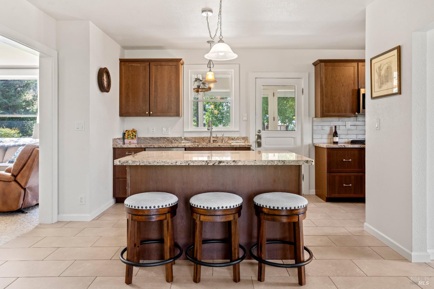 13850 Eel River Road Potter Valley, CA 95469 - Photo 4 of 26 a kitchen with stainless steel appliances a dining table and chairs