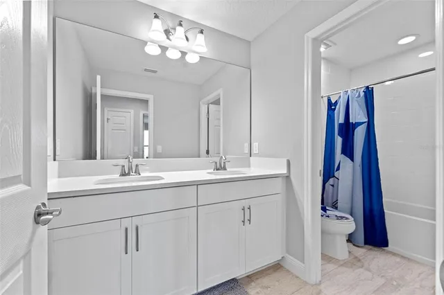 a bathroom with a shower and a toilet