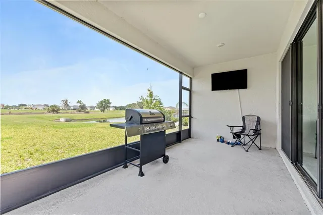 a room with gym equipment and a large window