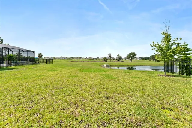a view of a lake with houses in the back