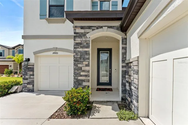 a front view of a house with garden