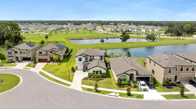 an aerial view of a house with a garden