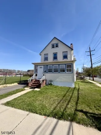 a view of a house with a big yard