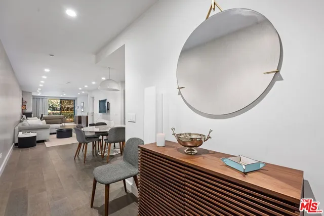 a view of a livingroom with furniture and a mirror