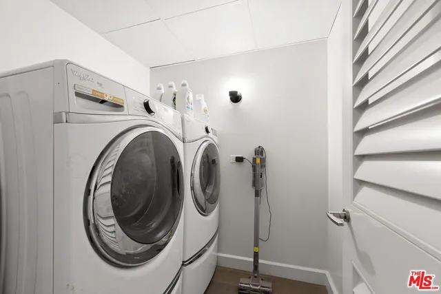 a bathroom with a sink vanity mirror and toilet