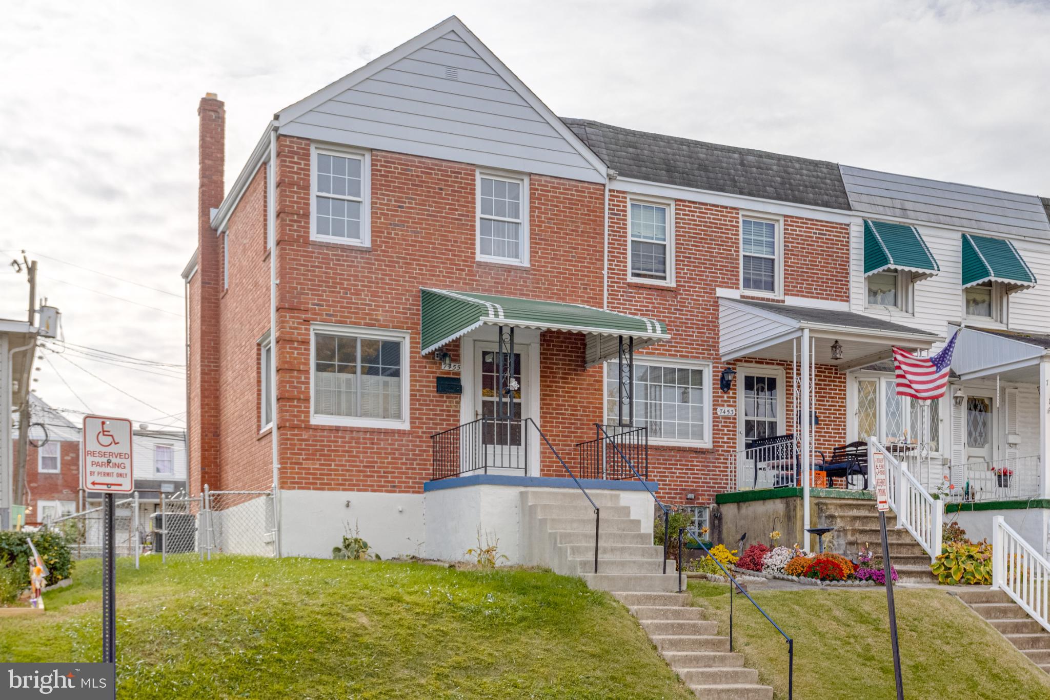 Charming brick home with inviting porch.