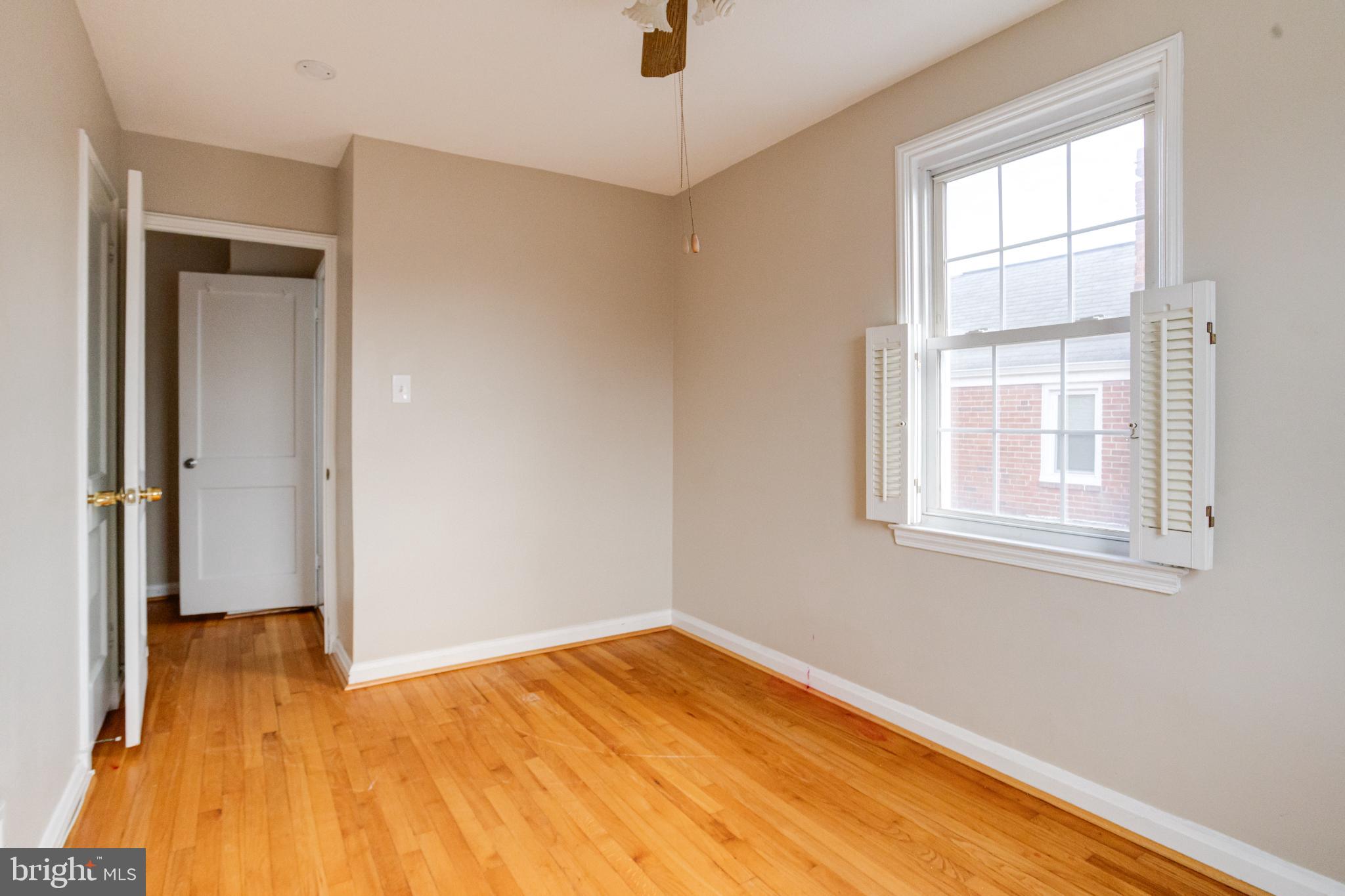 7455 Manchester Road Baltimore, MD 21222 - Photo 30 of 45 Bright and airy room with hardwood floors.