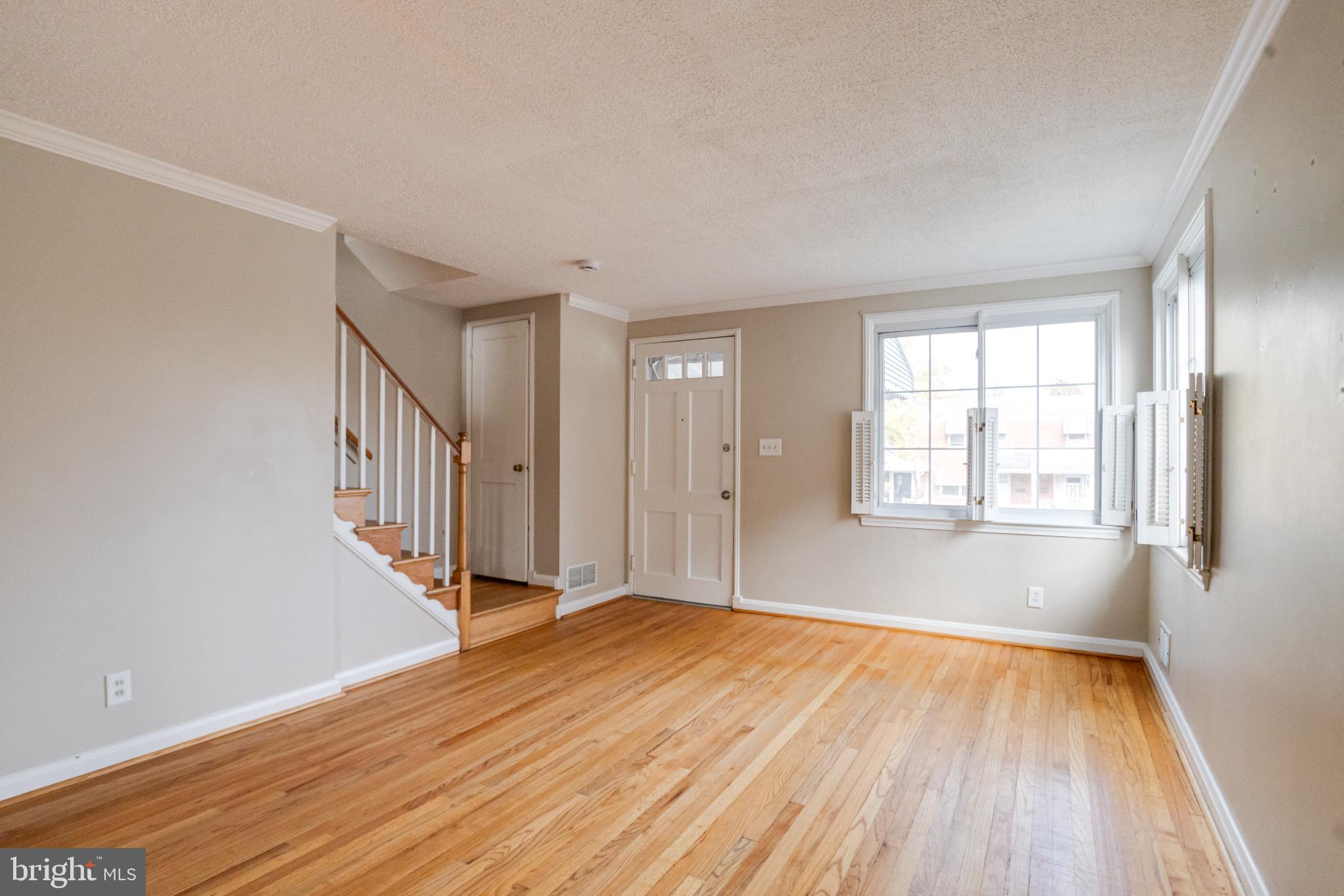 7455 Manchester Road Baltimore, MD 21222 - Photo 5 of 45 Bright and airy living space with hardwood floors.