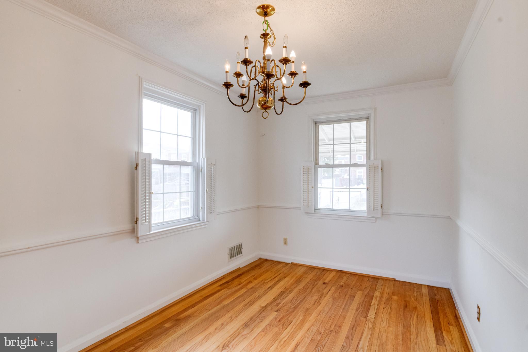 7455 Manchester Road Baltimore, MD 21222 - Photo 10 of 45 Bright, airy space with elegant chandelier.