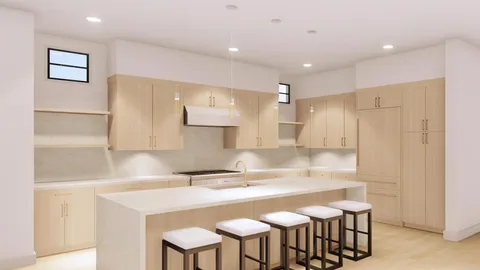 a kitchen with stainless steel appliances granite countertop a sink and a refrigerator