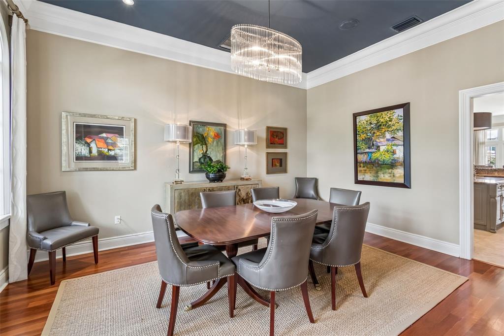 4804 Culbreath Isles Road Tampa, FL 33629 - Photo 12 of 70 a view of a dining room with furniture and wooden floor
