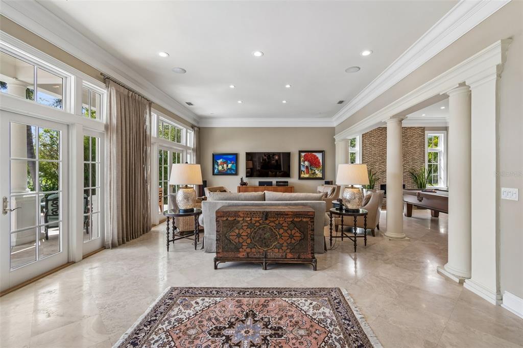 4804 Culbreath Isles Road Tampa, FL 33629 - Photo 19 of 70 a living room with furniture a rug and a fireplace