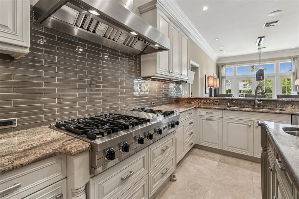 4804 Culbreath Isles Road Tampa, FL 33629 - Photo 24 of 70 a kitchen with stainless steel appliances granite countertop a stove sink and cabinets