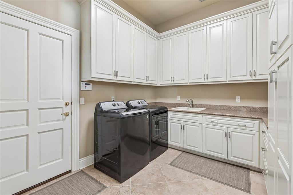 4804 Culbreath Isles Road Tampa, FL 33629 - Photo 26 of 70 a kitchen with granite countertop white cabinets and stainless steel appliances