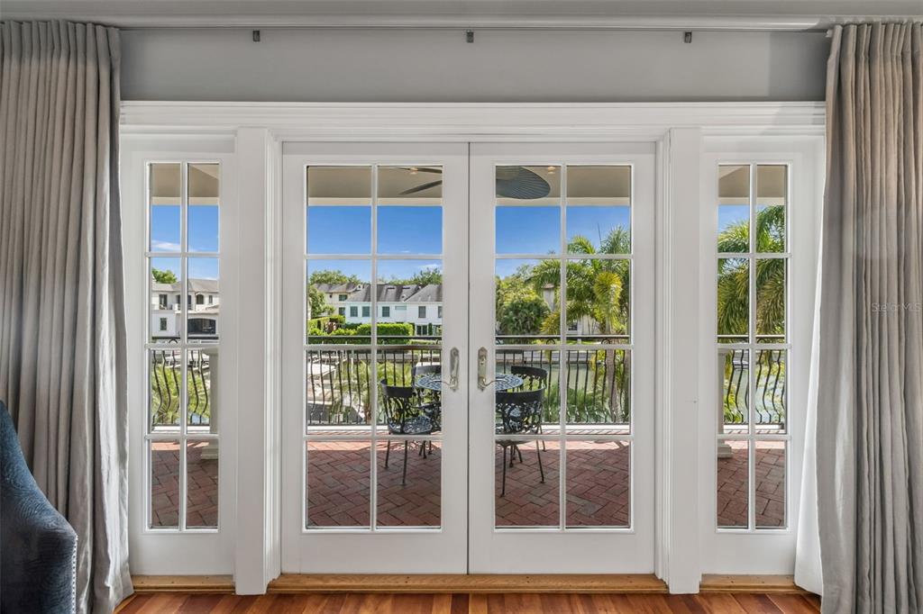 4804 Culbreath Isles Road Tampa, FL 33629 - Photo 30 of 70 a view of a brick house with large windows