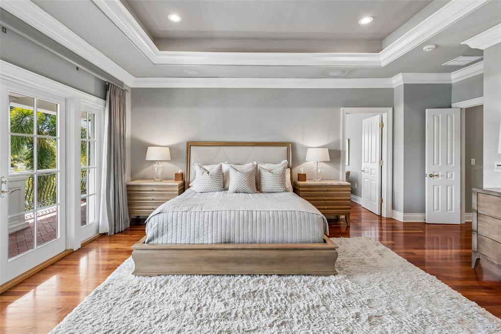 4804 Culbreath Isles Road Tampa, FL 33629 - Photo 10 of 70 a spacious bedroom with a bed and wooden floor