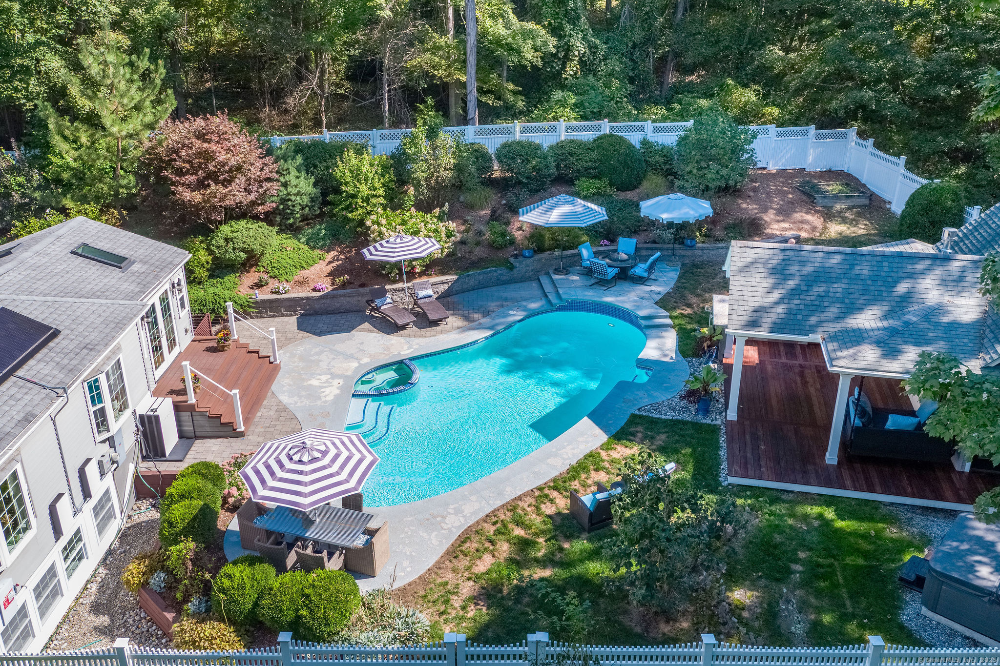 15 Buttonball Lane Madison, CT 06443 - Photo 1 of 1 a view of a table and chairs in patio