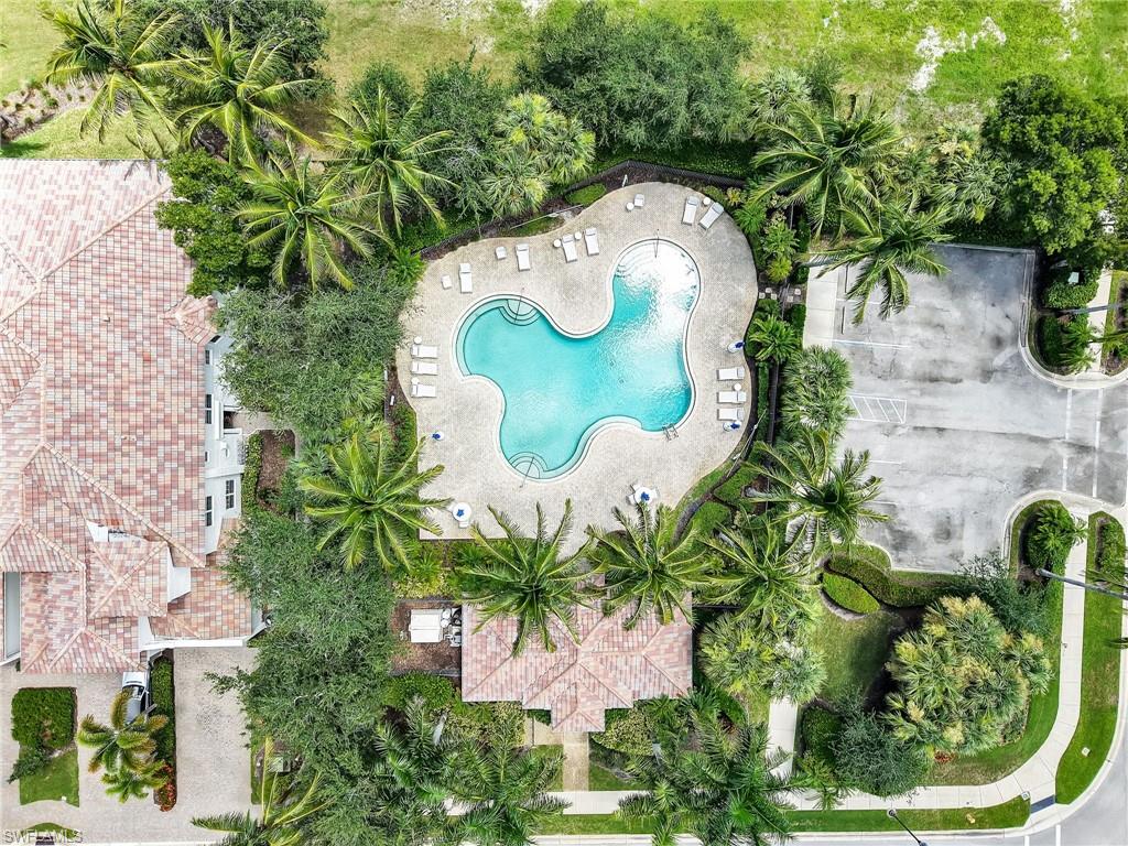 2718 Callista Court, Unit 101 Naples, FL 34114 - Photo 30 of 34 an aerial view of a house with a garden and swimming pool