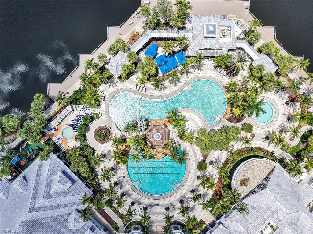 2718 Callista Court, Unit 101 Naples, FL 34114 - Photo 32 of 34 an aerial view of a fireplace with lots of potted plants