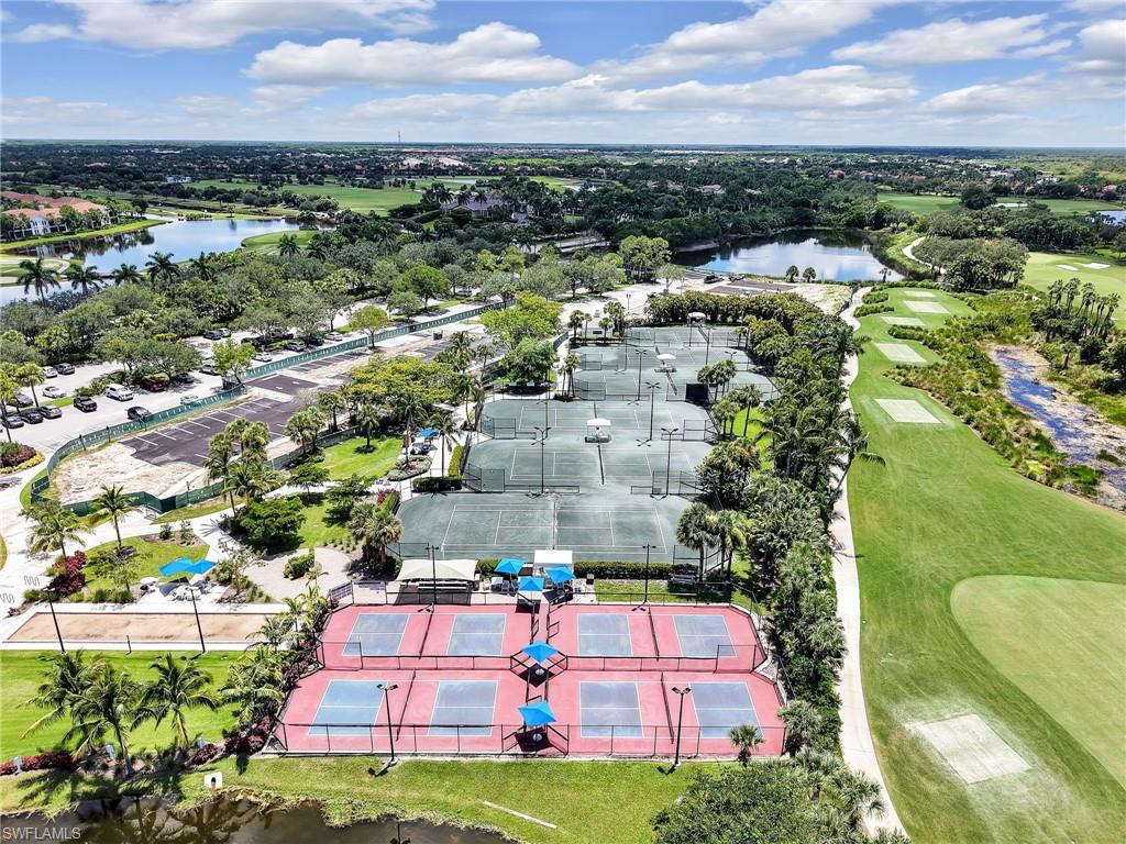 2718 Callista Court, Unit 101 Naples, FL 34114 - Photo 34 of 34 an aerial view of multiple houses with yard