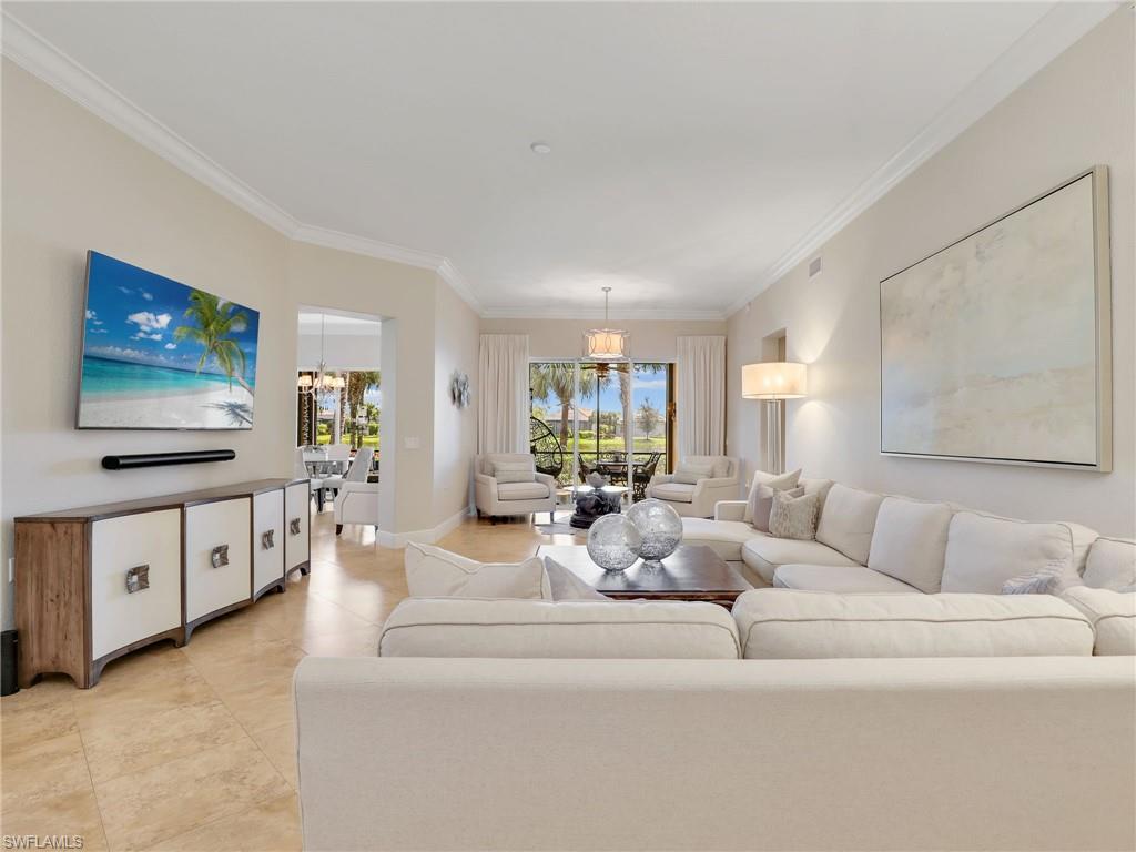 2718 Callista Court, Unit 101 Naples, FL 34114 - Photo 4 of 34 a living room with furniture and a flat screen tv