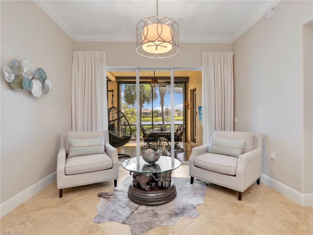 2718 Callista Court, Unit 101 Naples, FL 34114 - Photo 6 of 34 a living room with furniture and a chandelier