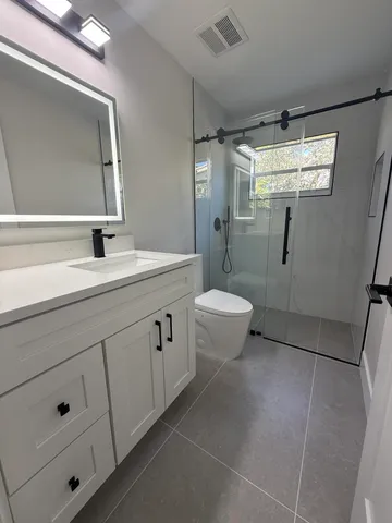 a view of an empty room with a window