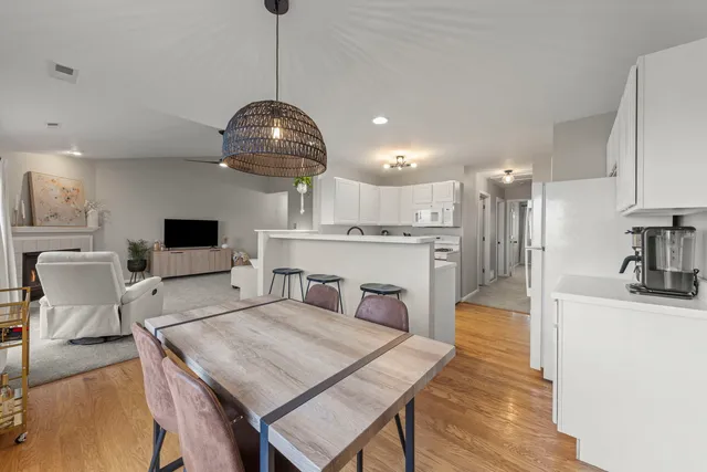 a view of a dining room kitchen and a wooden floor