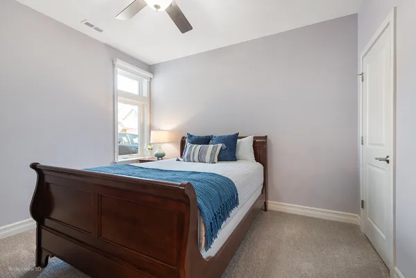 a bedroom with a bed and window