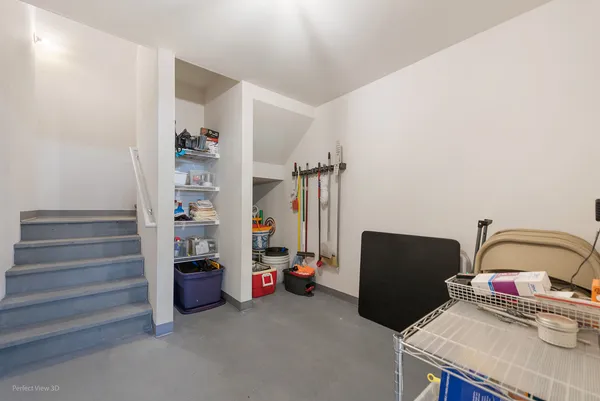 a bedroom with bed and a cabinet