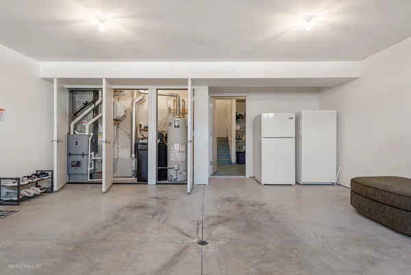 an empty room with closet and mirrors