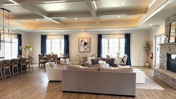 a living room with furniture wooden floor and a fireplace