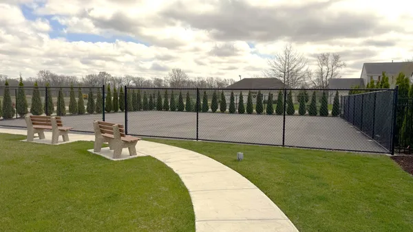 a view of a backyard with sitting area