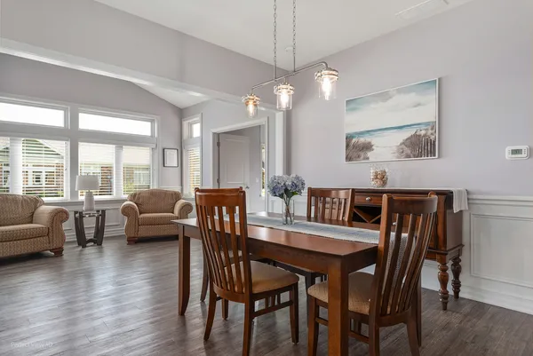 a view of a dining room with furniture window and wooden floor